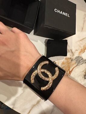 CHANEL Black Resin Cuff with Gold Interlocking CC